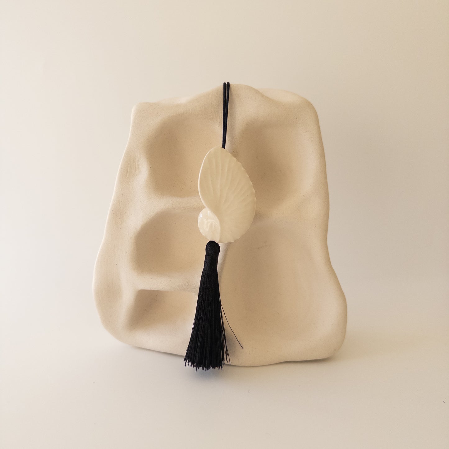 Мушля Октопус з китицею