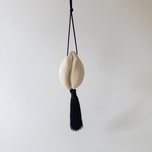 Cowrie with tassel