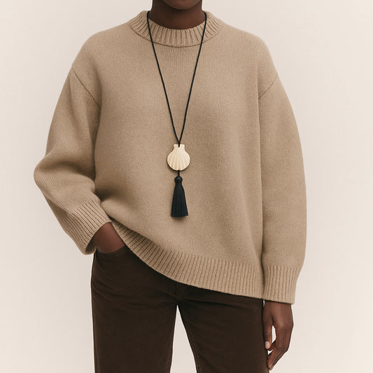 Мушля Гребінець з китицею