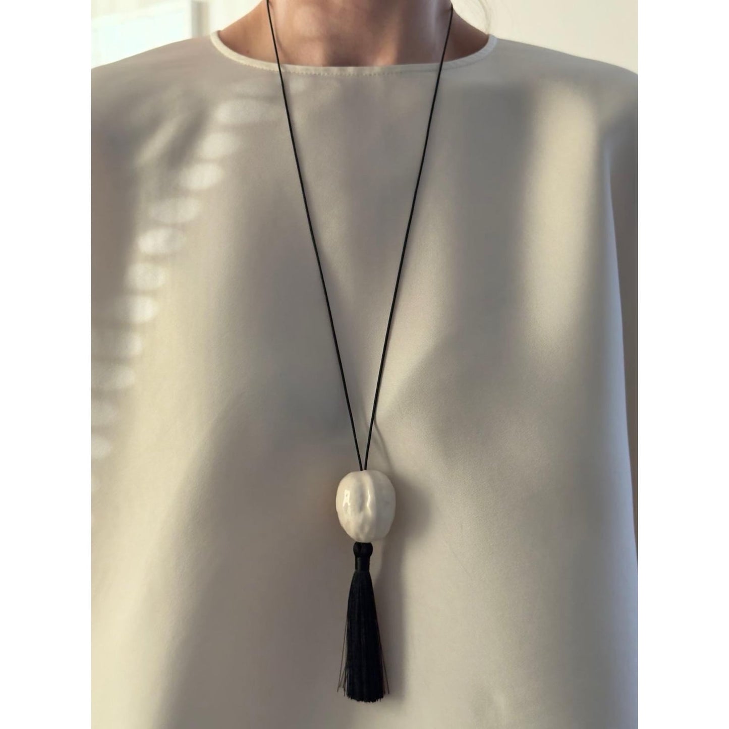 Nut with tassel